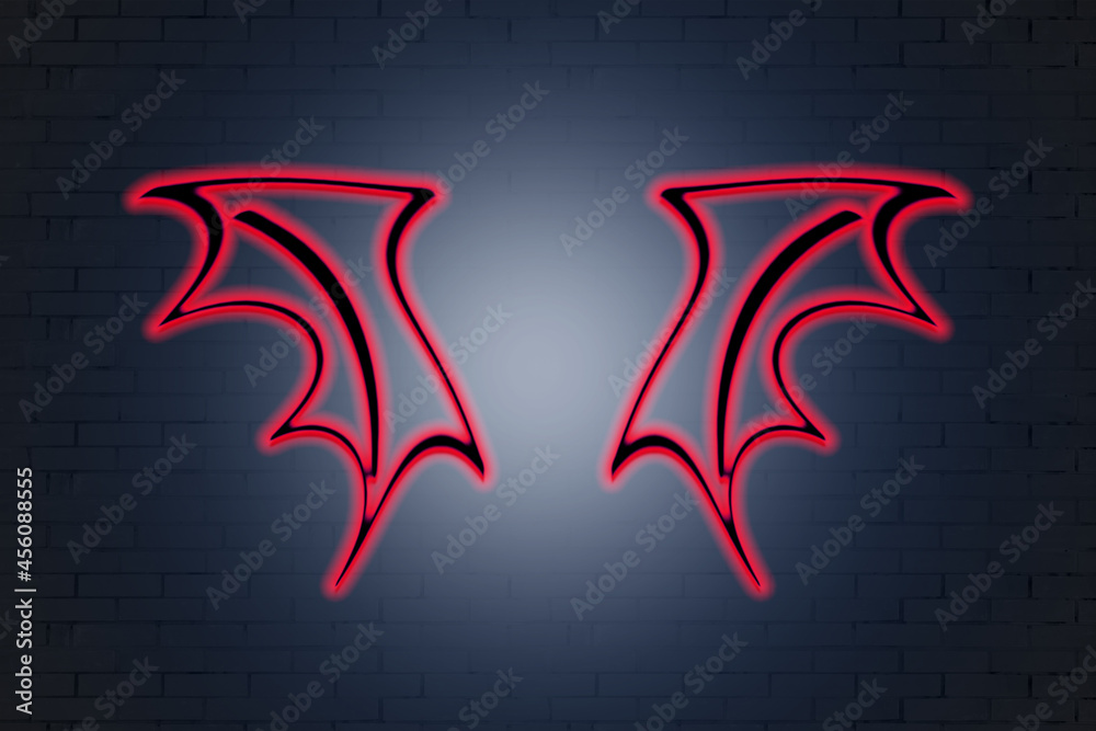 Obraz premium neon red wings on a brick wall background