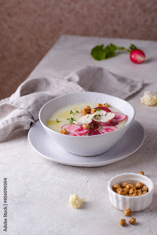 Cauliflower soup puree decorated with radish Cauliflower soup puree decorated with radish