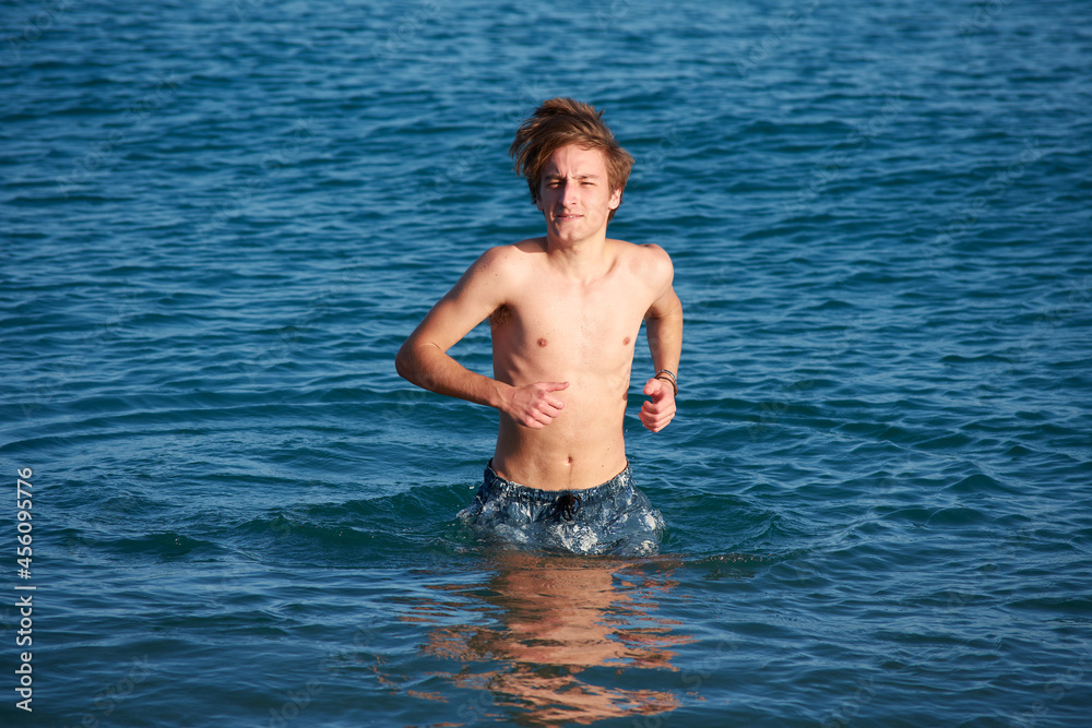 A portrait of a young fit caucasian male in the sea A portrait of a young fit caucasian male in the sea