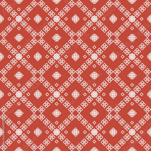 ethnic pattern with geometric seamless flower in red background for fabric