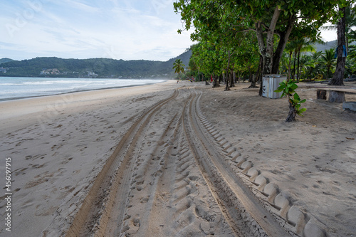 4x4 tyre tracks crisscrossing Tire tracks on the sand texture background at Patong beach Phuket Thailand