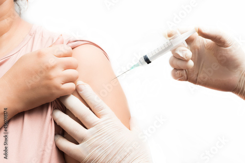 Vaccination  immunization  disease prevention concept. Nurse or medical professional administering antiviral injection to patient in arm