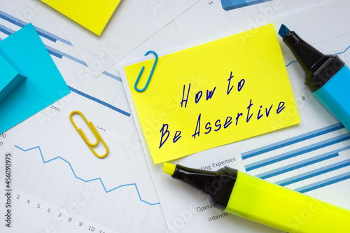 Photos Financial concept meaning How to Be Assertive with phrase on the sheet