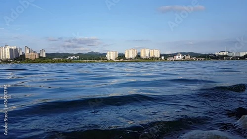 Slow motion view of sunset nearby a lake in the out-skit the city,