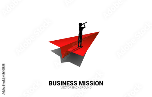 Silhouette of businessman looking through telescope on origami paper airplane. Business Concept of leadership and vision mission.