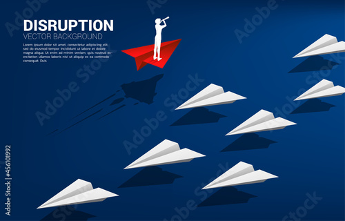 Silhouette of businessman looking through telescope standing on red origami paper airplane go different way from group of white. Business Concept of disruption and vision mission.