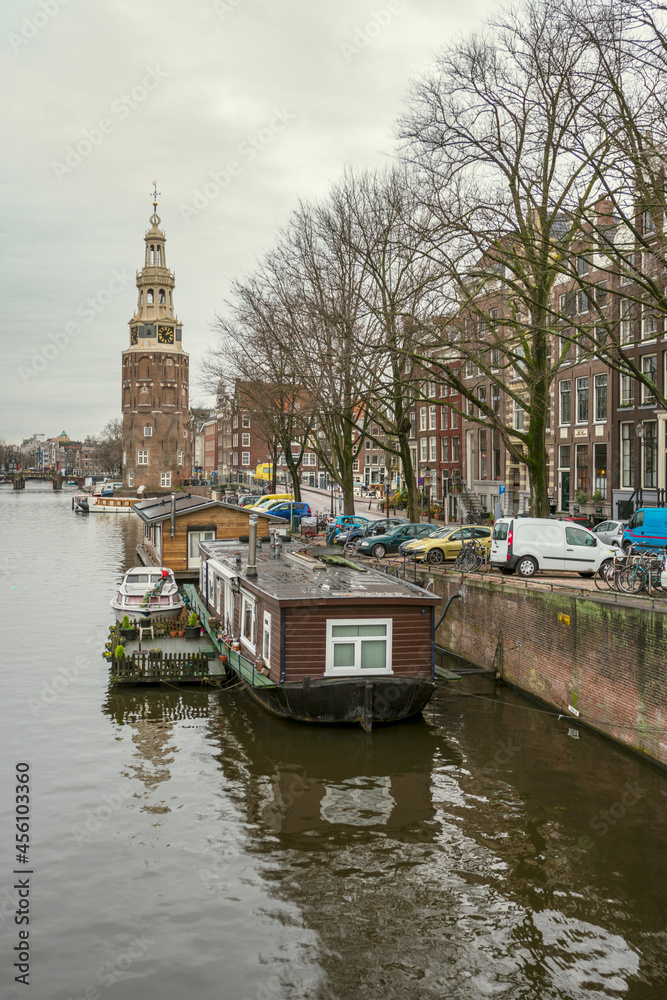Houseboats with a terrace moored on a canal in the center of Amsterdam