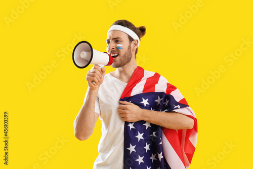 Sport fan with USA flag and...