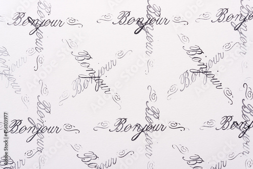 rubber stamp background with the french word bonjour