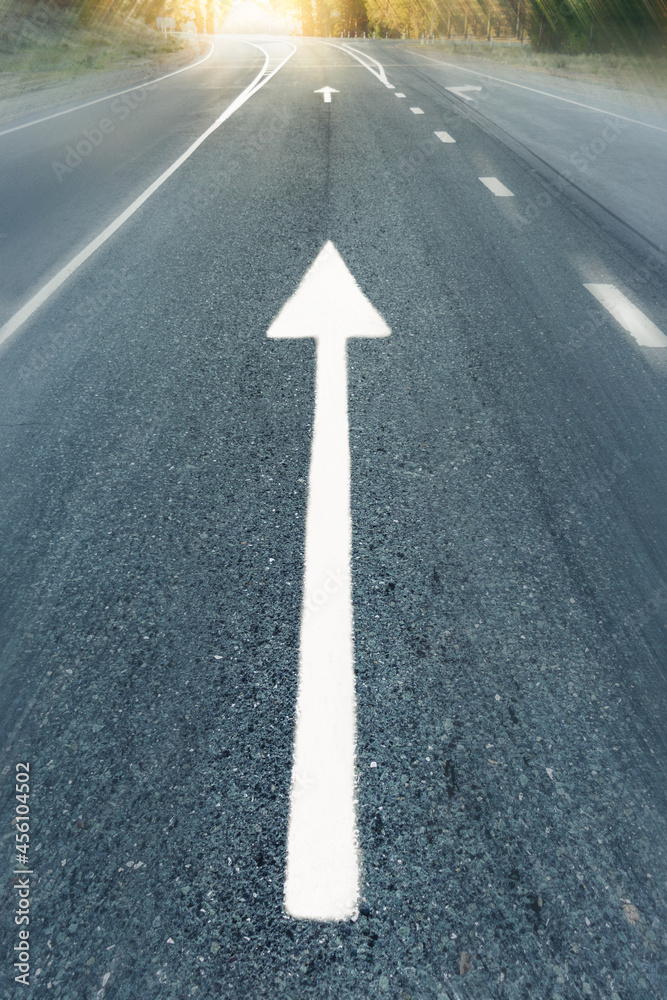 arrow on the road in motion and speed. dawn on the horizon Conceptual image of asphalt road and direction arrow. Conceptual image of asphalt road and direction arrow
arrow on the road in motion and speed. dawn on the horizon Conceptual image of asphalt road and direction arrow. Conceptual image of asphalt road and direction arrow