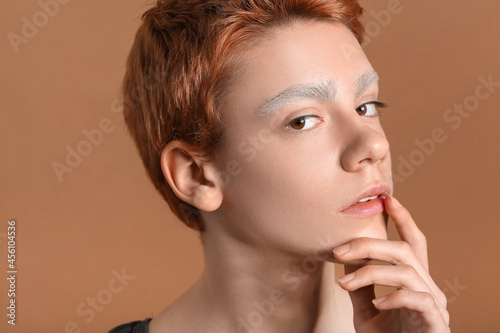Teenage boy with dyed eyebr...