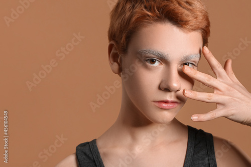 Teenage boy with dyed eyebr...