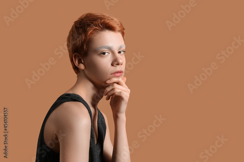 Teenage boy with dyed eyebr...