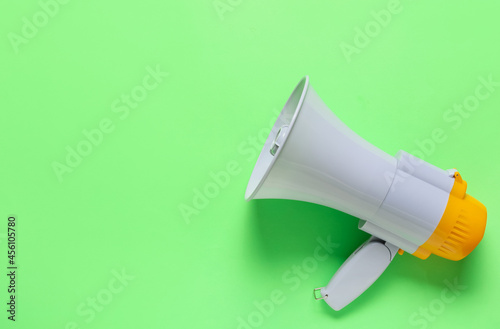 Modern megaphone on color background