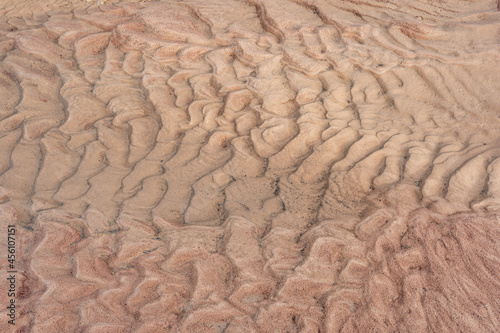 The surface of the sandy soil is wavy that occurs after the rain. Natural backgrounds are made to be interesting
