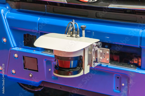 2D LiDAR sensor on the front bumper of an unmanned vehicle, close-up. An part of the self-driving system of the truck photo