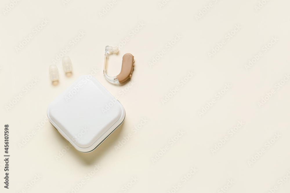 Box with hearing aid on white background Box with hearing aid on white background