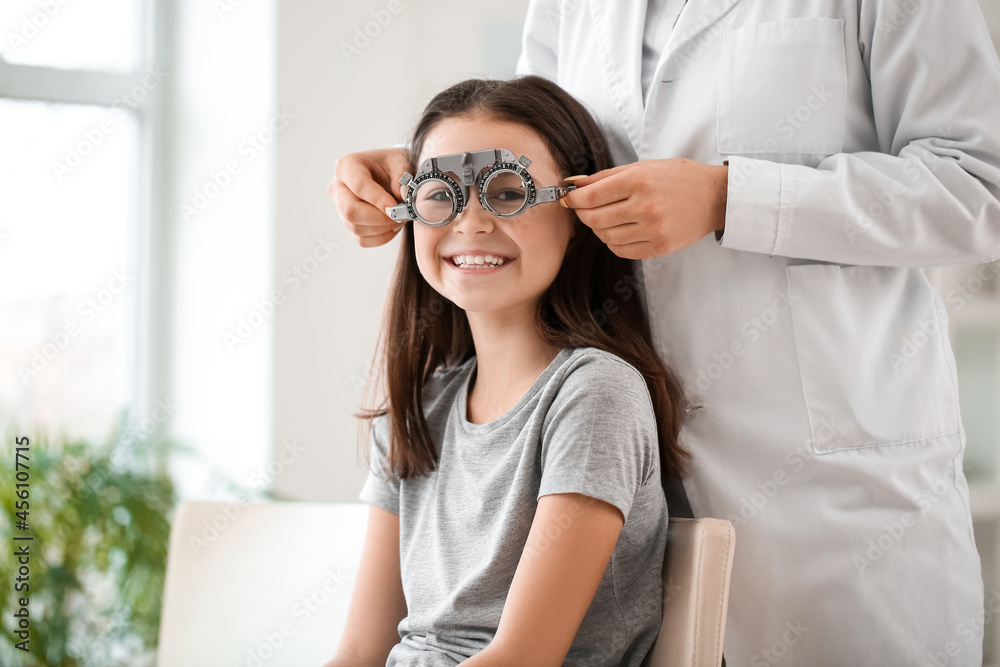 Little girl undergoing eye test in clinic Little girl undergoing eye test in clinic