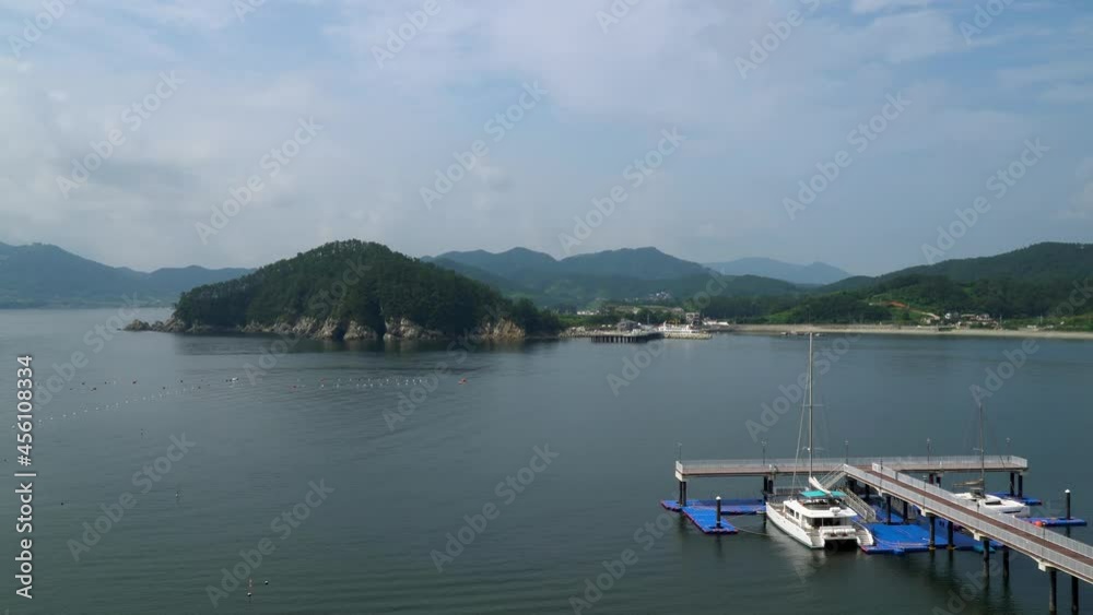 Beautiful Green Hills And Calm Sea In Geonje City South Korea - wide shot Beautiful Green Hills And Calm Sea In Geonje City South Korea - wide shot