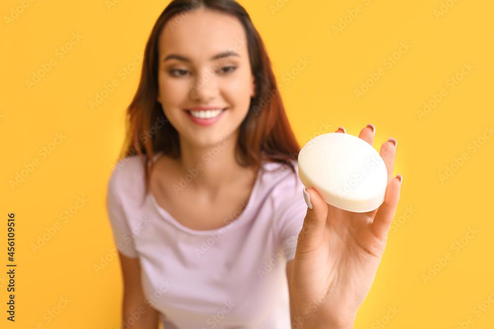 Beautiful young woman with soap on color background Beautiful young woman with soap on color background