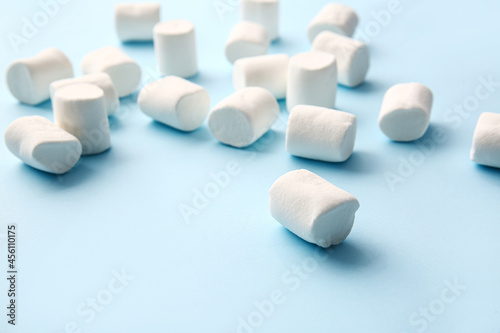 Tasty marshmallows on color background, closeup