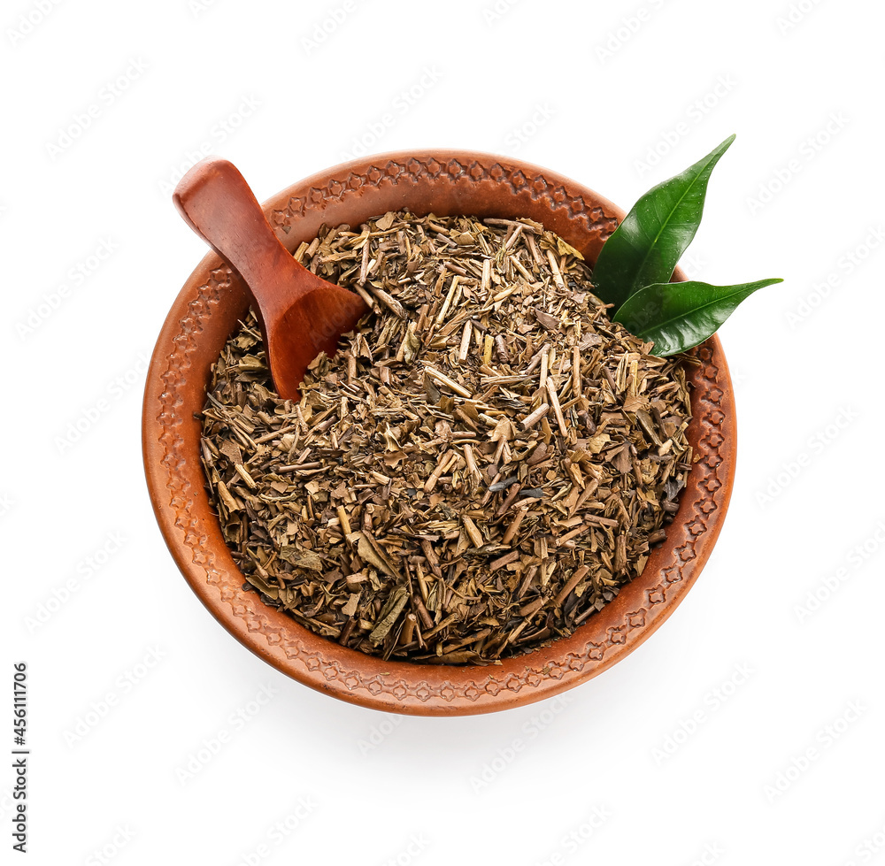 Bowl of dry hojicha green tea on white background Bowl of dry hojicha green tea on white background