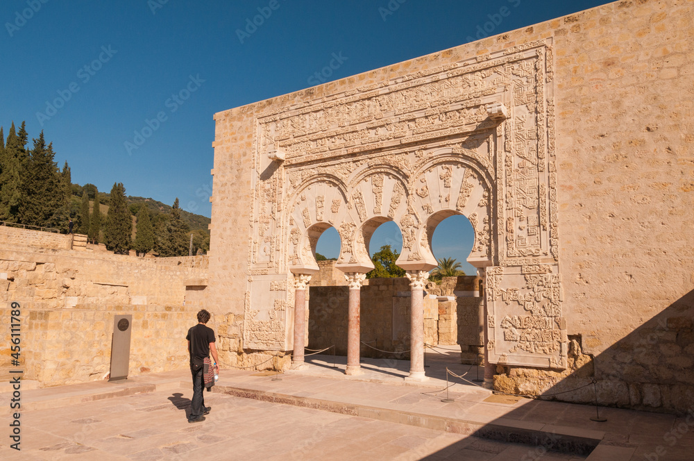 Tourist visiting Yafar´'s house entrance at Medina Azahara. Restoration ...