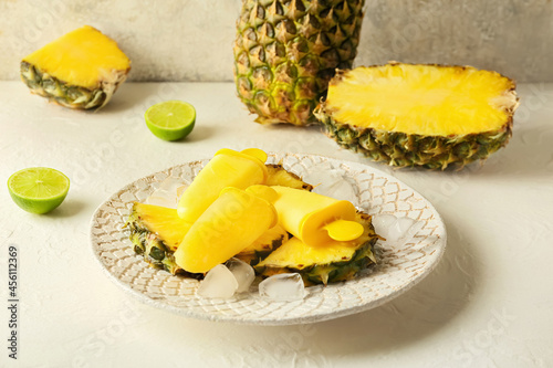 Plate with tasty pineapple ...