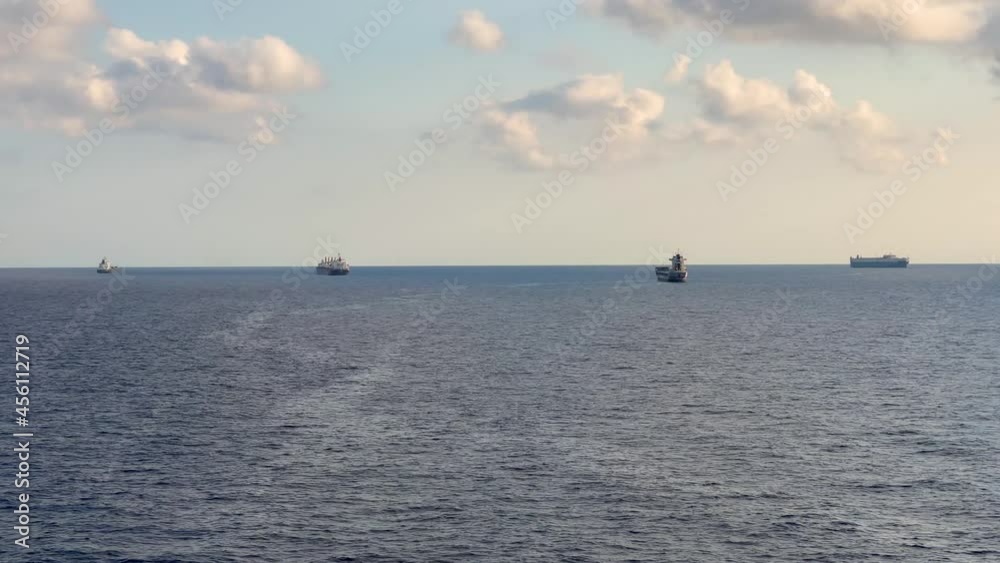 Cargo ship parked parked in the middle of the ocean moving view Cargo ship parked parked in the middle of the ocean moving view