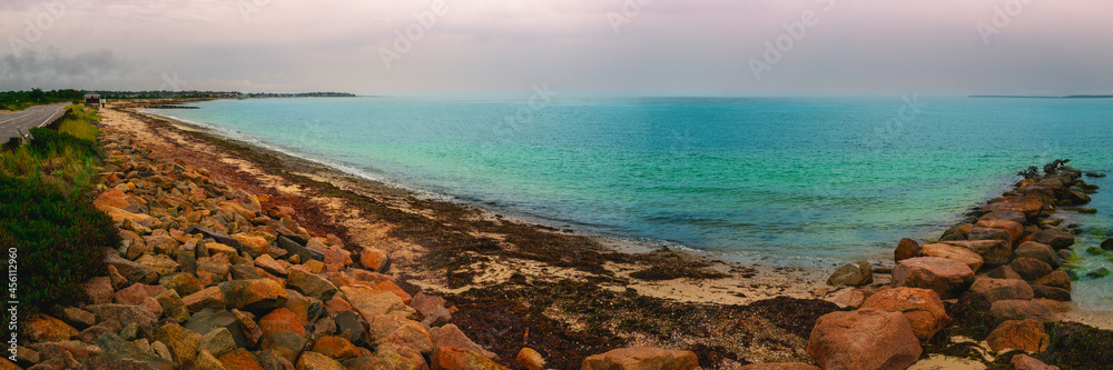 Panoramic seascape over the jetty on Cape Cod at rainy dusk