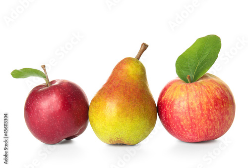 Ripe pear and apples on white background