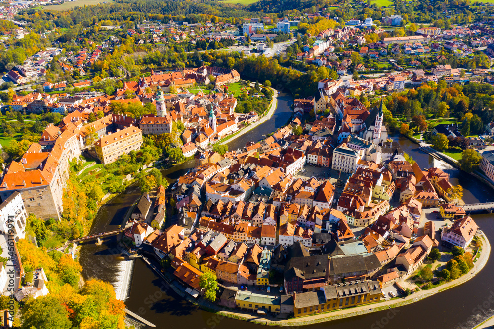 View from drone of historical houses of Czech city Cesky Krumlov in sunny fall day