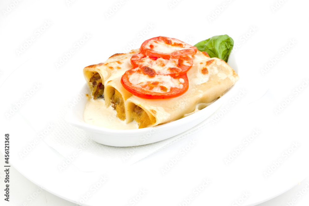 Pasty hot lasagna served with a basil leaf on a gray plate. Italian cuisine, menu, recipe. Homemade meat lasagna. Copy space for text, top view

