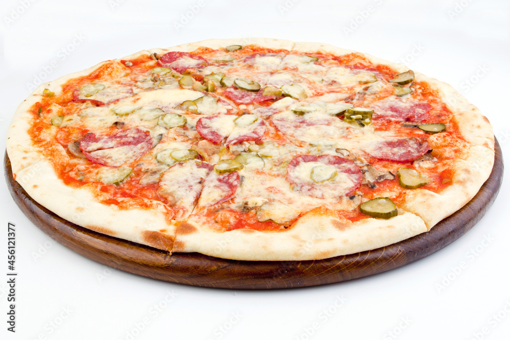 Italian pizza with melted mozzarella cheese, olives and tomato garnished isolated on white background Italian pizza with melted mozzarella cheese, olives and tomato garnished isolated on white background