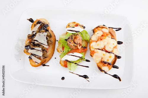 salmon bruschets with mozzarella with zucchini and balsamic sauce

