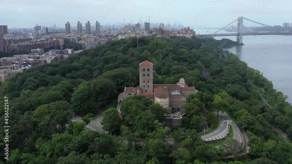 Long and slow aerial level orbit of The Cloisters museum in Upper Manhattan NYC. Views of Midtown, the George Washington Bridge and Washington Heights in the background Long and slow aerial level orbit of The Cloisters museum in Upper Manhattan NYC. Views of Midtown, the George Washington Bridge and Washington Heights in the background