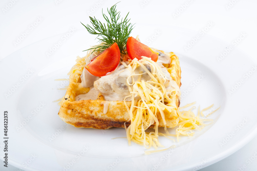 Belgian waffles with meat filling and mushroom sauce
