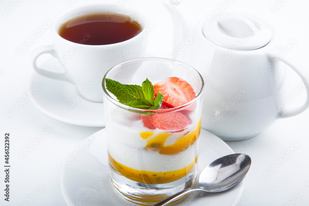 delicious sweet dessert on white plate with tea
delicious sweet dessert on white plate with tea