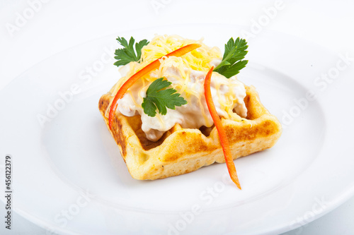 Belgian waffles with meat filling and mushroom sauce 