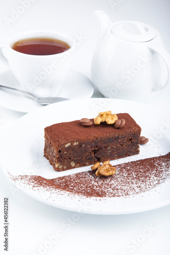 delicious sweet dessert on white plate with tea
