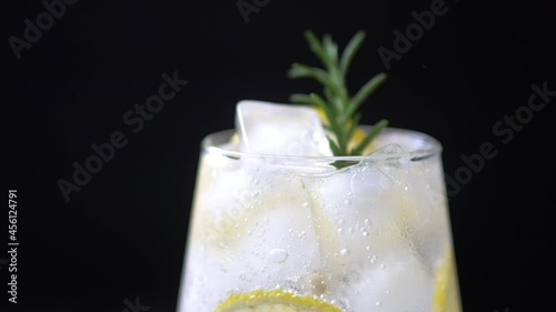 Healthy iced lemon drink for detoxification poured in glasses. Iced lemon drink is a healthy beverage for detoxification. Some might drink lemon infused water with gin for cocktail. 