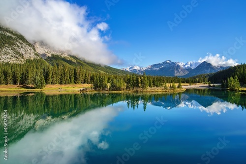 Fototapeta Naklejka Na Ścianę i Meble -  Blue Sky And Clouds Reflecting On Cascade Ponds