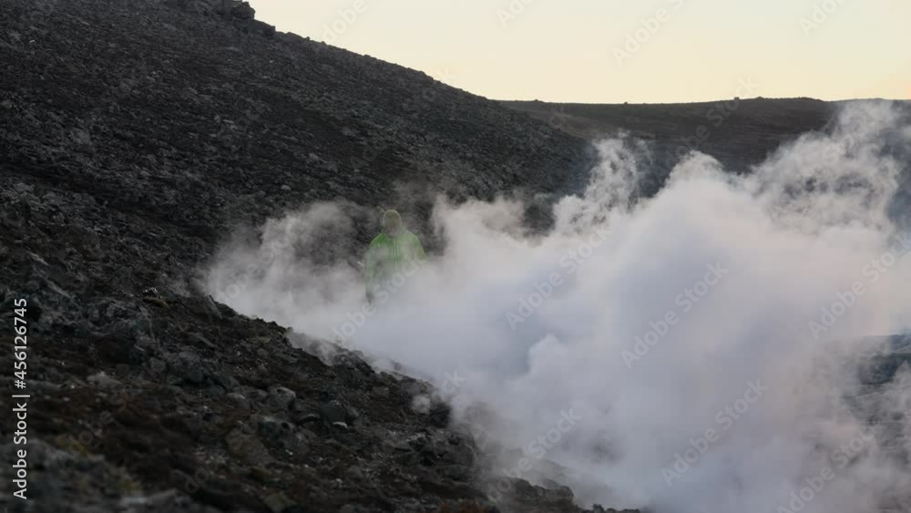 Man Walking Through Smoke Of Lava Flow From Erupting Fagradalsfjall Volcano Man Walking Through Smoke Of Lava Flow From Erupting Fagradalsfjall Volcano