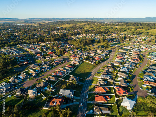 Aerial streetscape of houses and empty lots