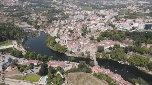 Establishing aerial above view of the historic parish townscape and famous Sao Goncalo church, Amarante. photo