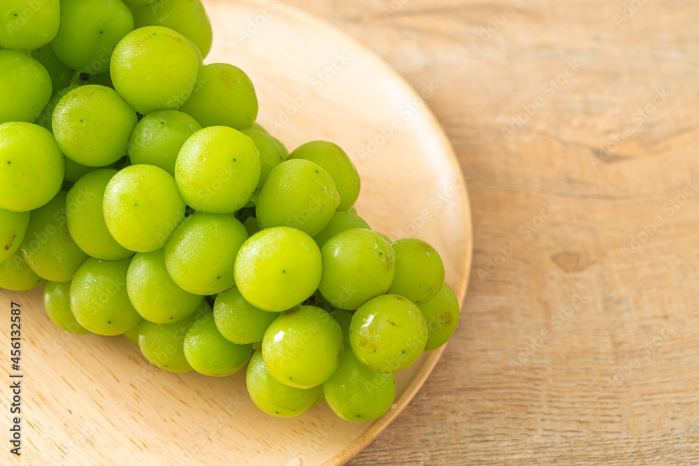 fresh green grape on wood plate fresh green grape on wood plate