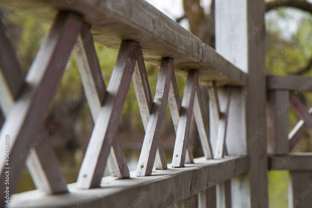Wooden interlacing ornament in the alcove. Fence decoration under open air. Wooden interlacing ornament in the alcove. Fence decoration under open air.
