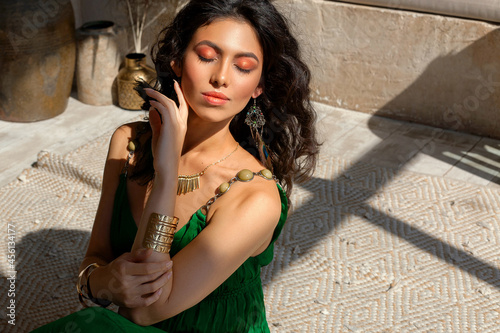 Beautiful girl posing in a middle eastern room interior