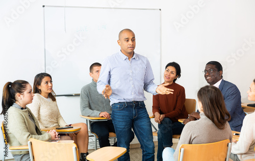 Teacher conducts a refresher course for employees