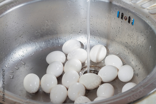 Wash chicken eggs in the kitchen sink with soap and water before cooking eggs